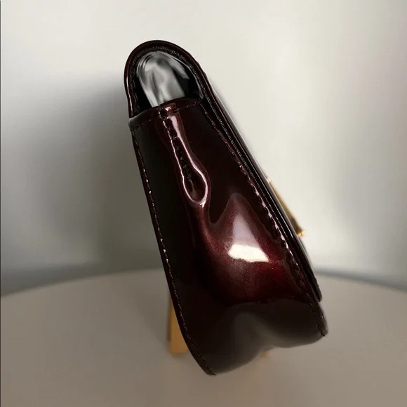 Louis Vuitton Burgundy Sobe clutch with Brass Hardware